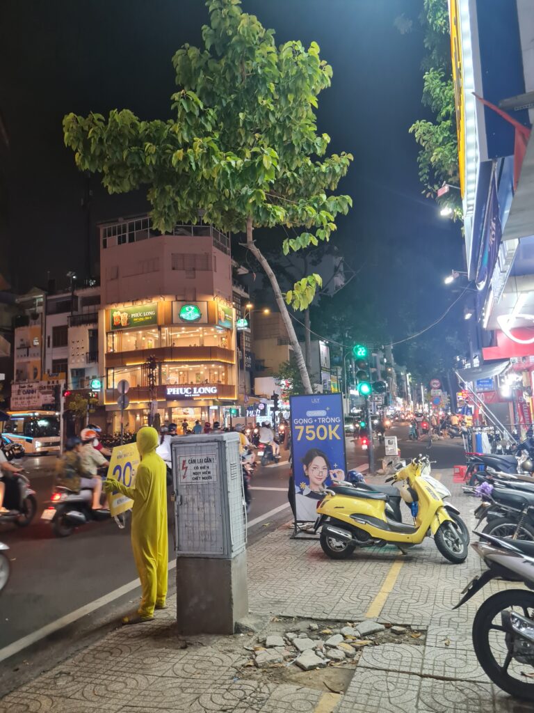 District 5 Ho Chi Minh City Walkabout, yellow man and scooter