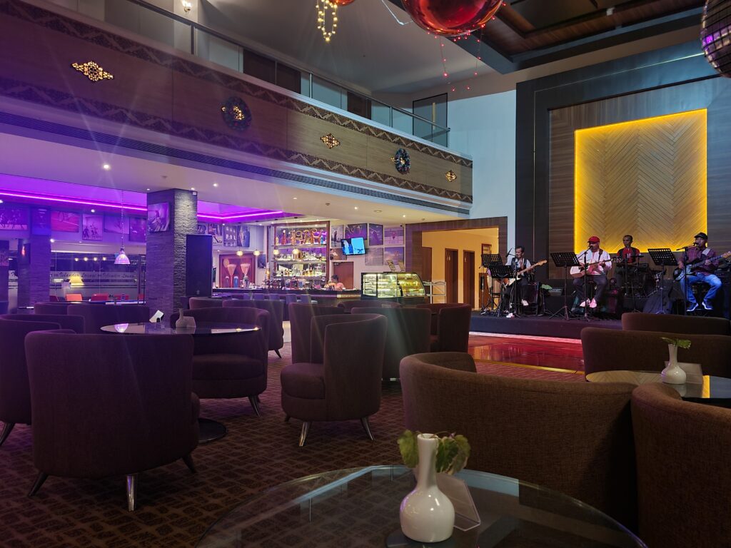 Live band performing at the Islander Lounge in Batam View Beach Resort at night.