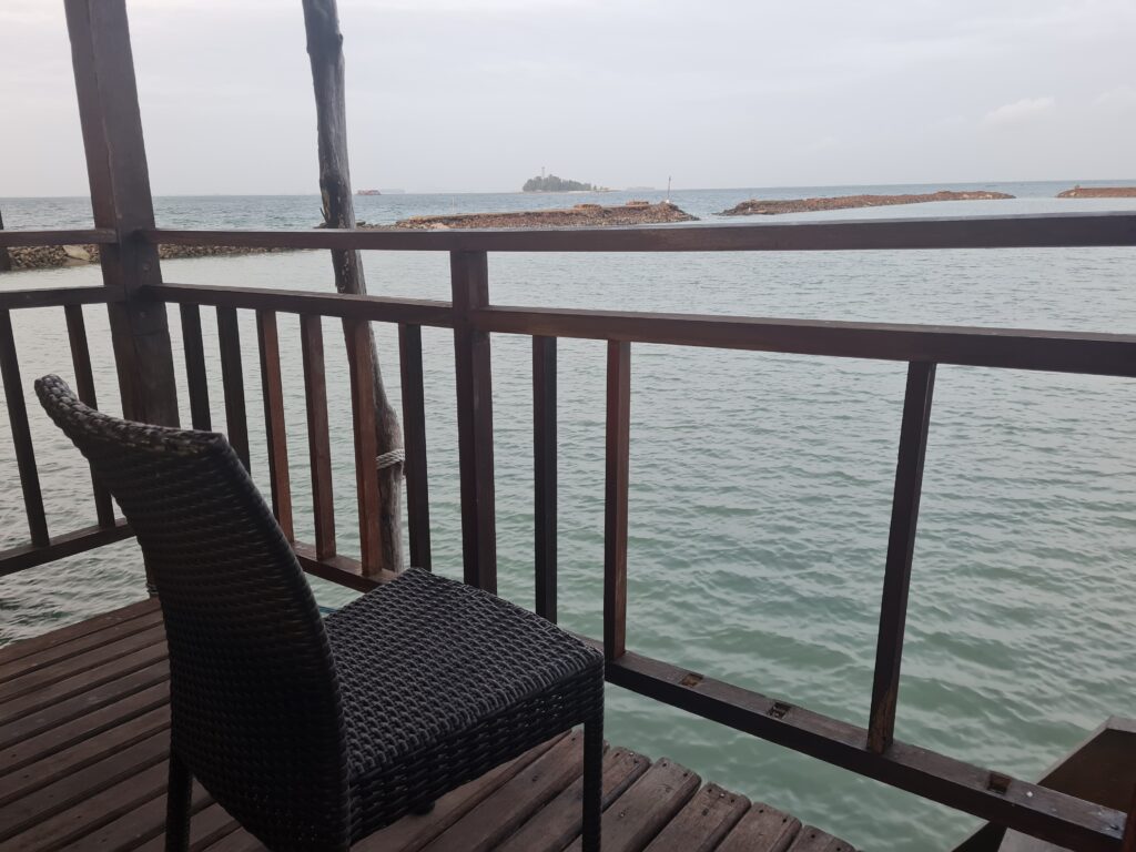 Relaxing sea view from the balcony of Batam View Beach Resort Villa overlooking the Singapore Strait.
