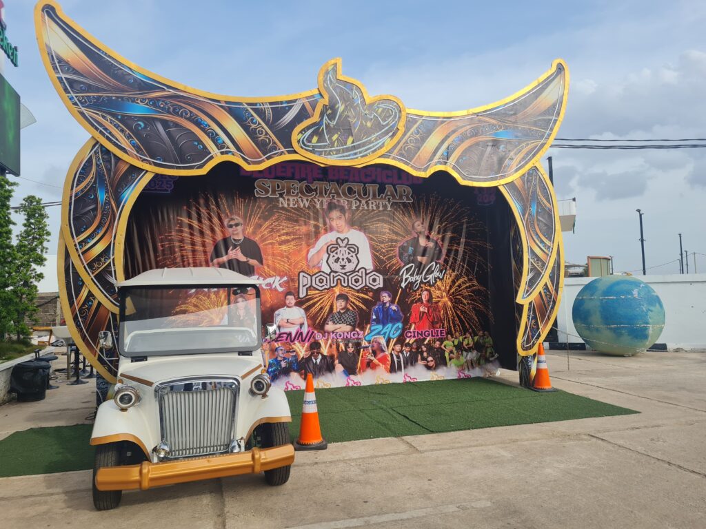 Entrance signage of Bluefire Beach Club in Batam with blue sky background.