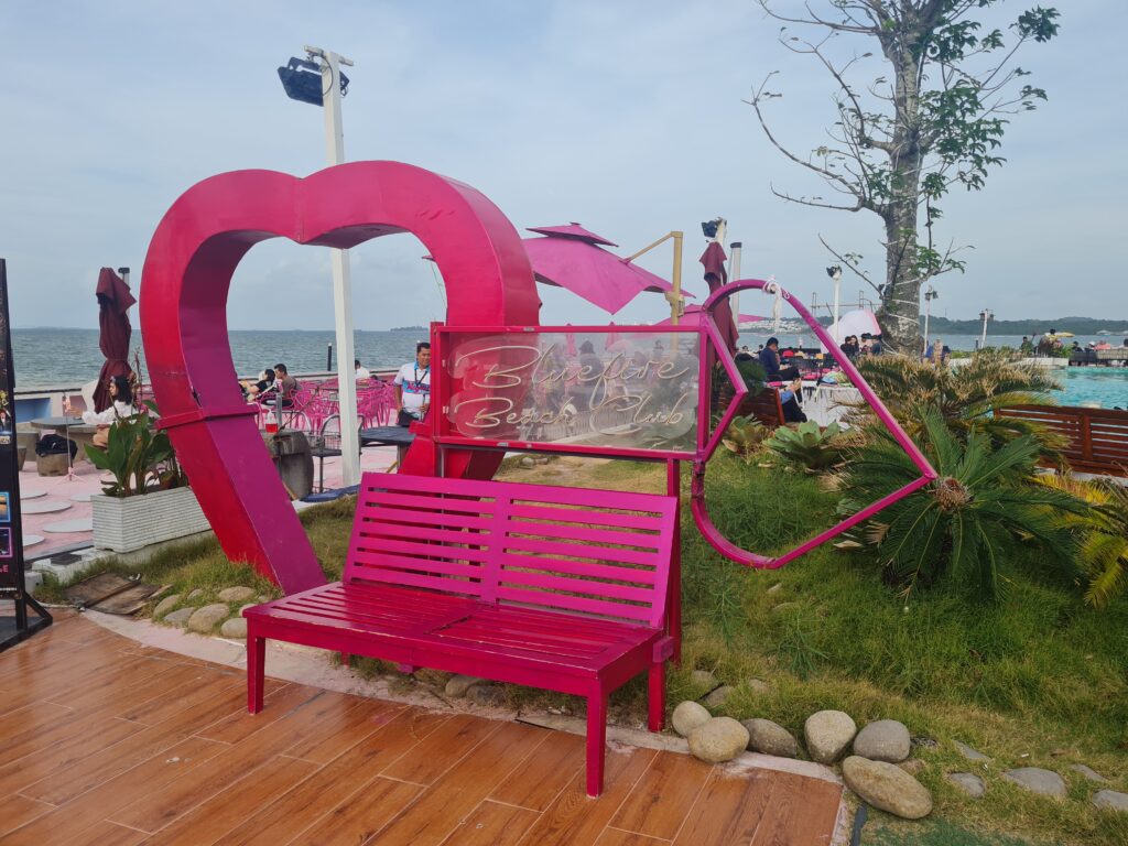 Instagrammable pink seat with a love sign