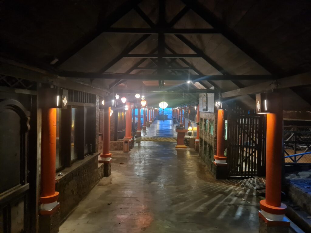 Traditional lanterns hanging from the wooden roof at Kelong Seafood Sunset Bistro, adding to the romantic ambiance.