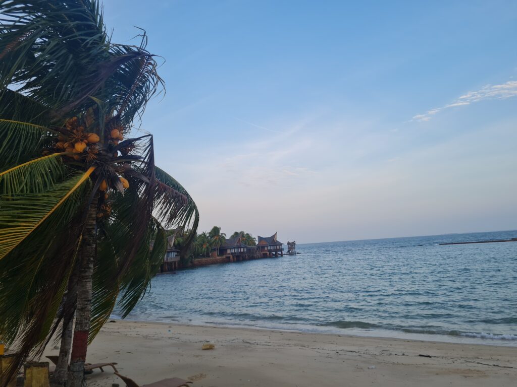 High-angle view of the unique cone-shaped villa roofs and landscaping at Batam View Beach Resort.