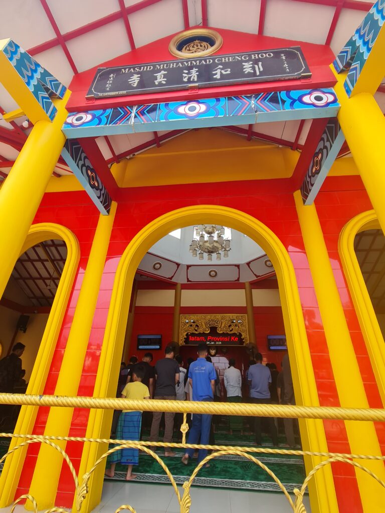 Interior view of Cheng Ho Mosque Batam showing a blend of calligraphy and Chinese motifs.
